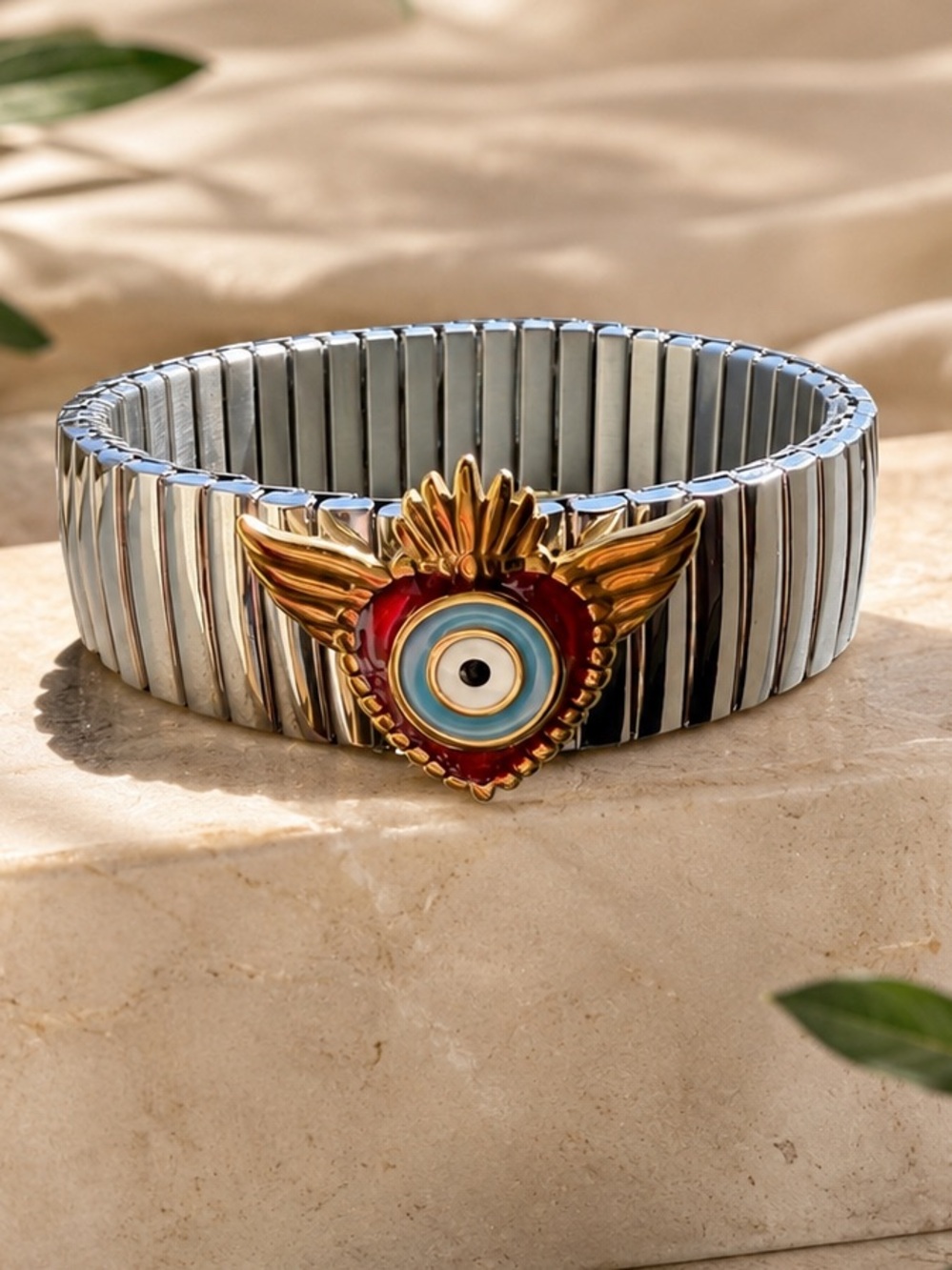 Silver Stretch Bracelet with Fish and Gold Red Evil Eye Accent